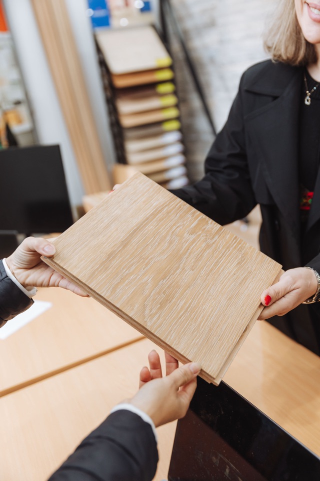 Handing over an oak sample at the counter