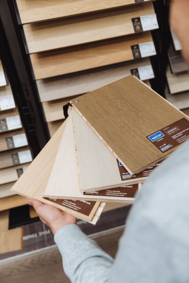 Comparing timber samples fanned out in hand