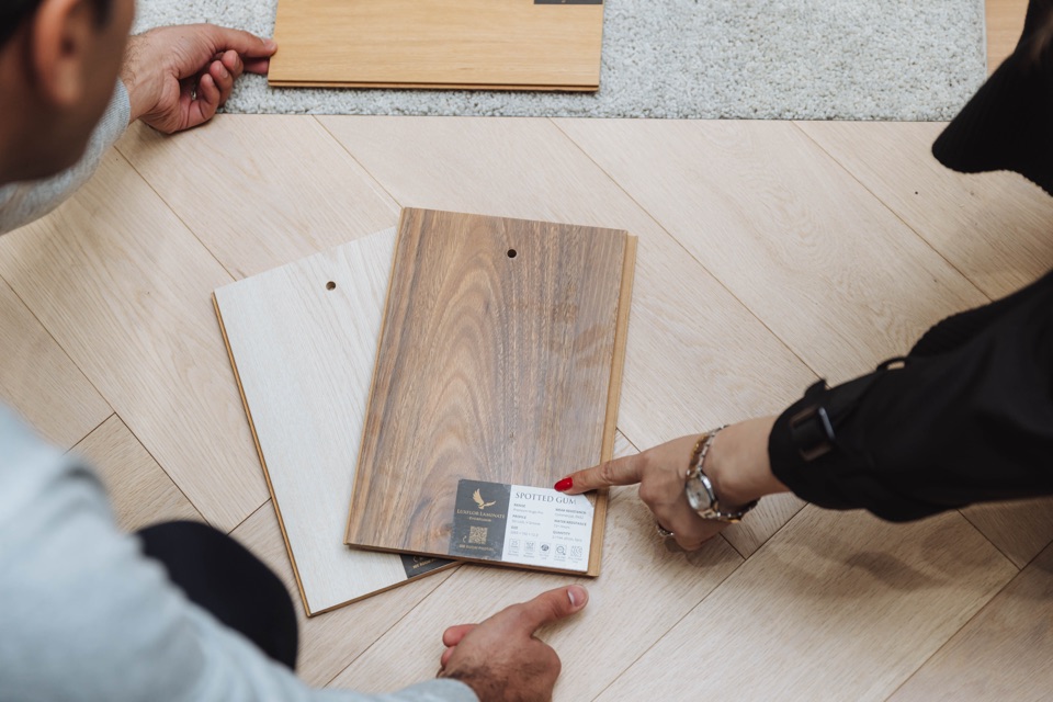 Spotted gum sample laid over pale oak