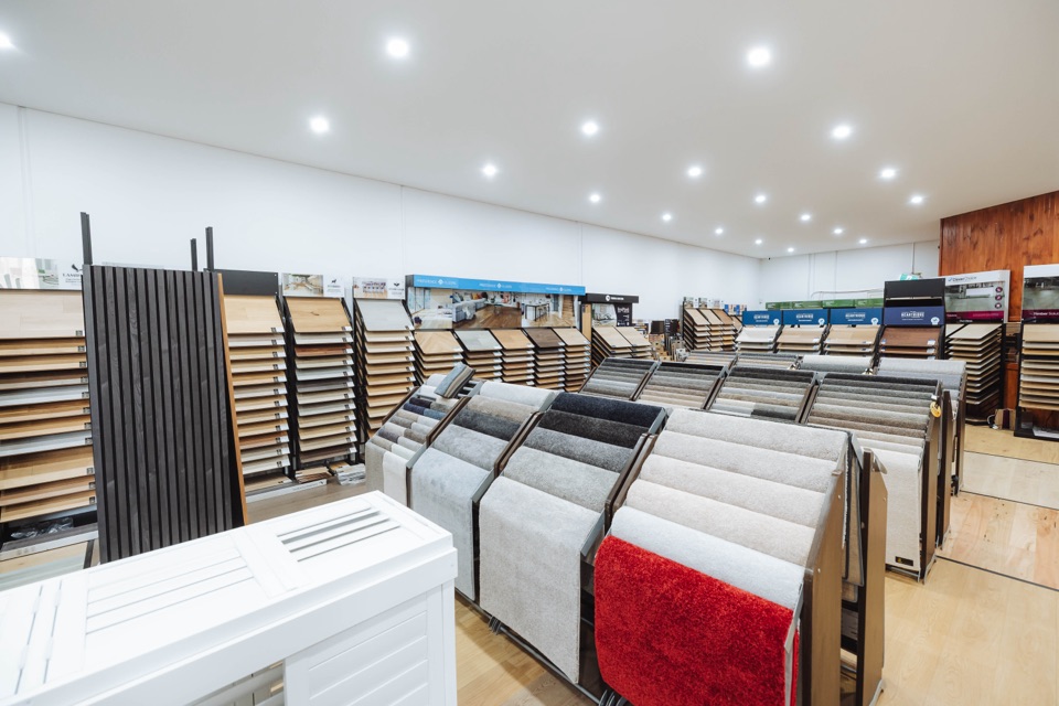 Carpet and timber displays fill the showroom