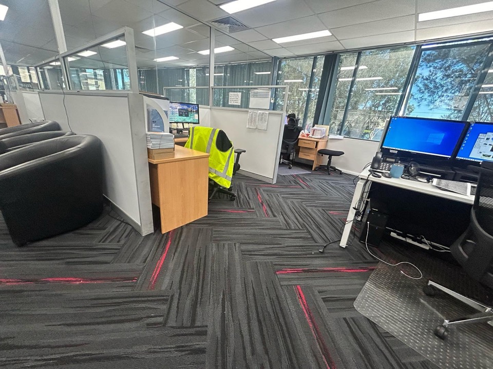 Herringbone carpet tiles across the open office