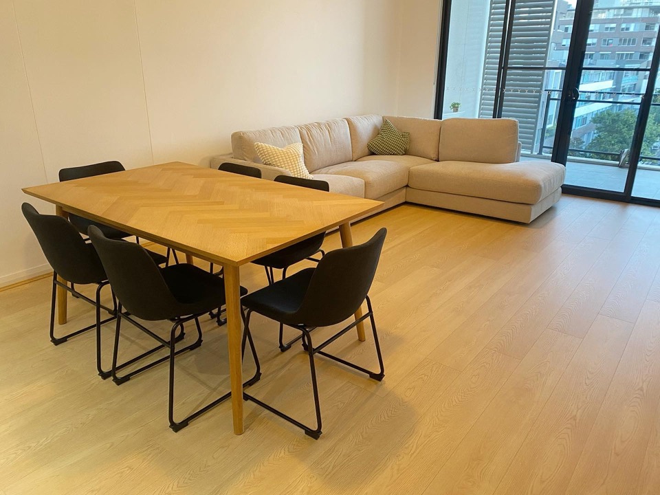 Cream oak laminate runs to the balcony doors