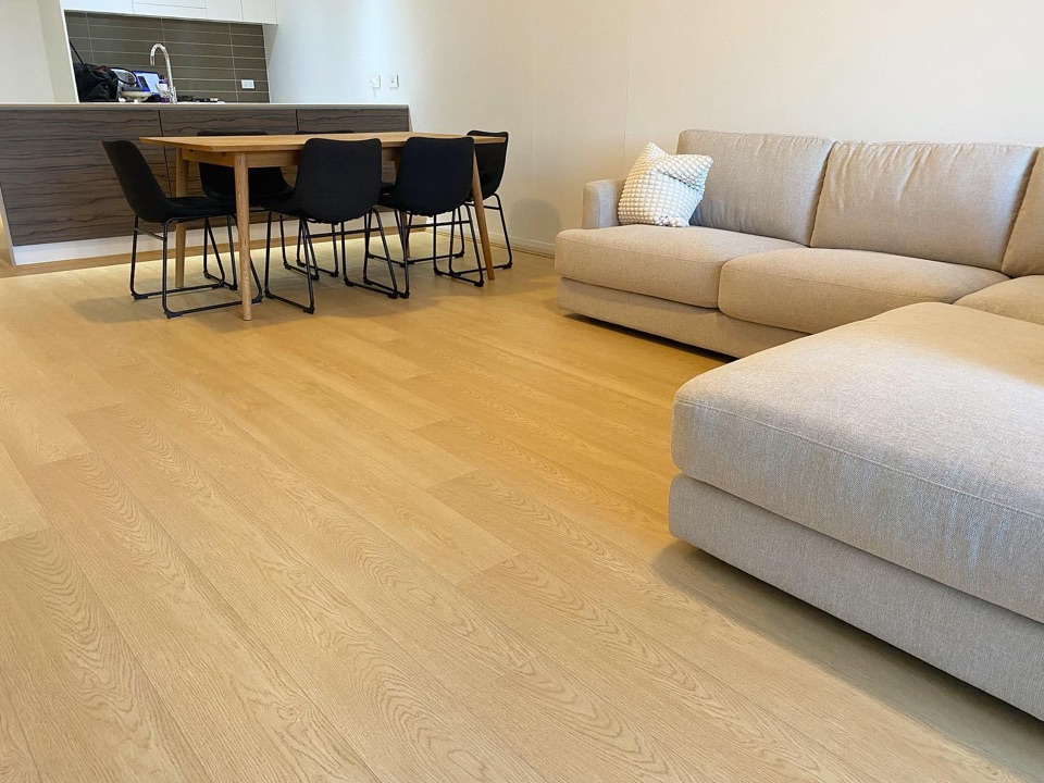 Cream oak laminate across the open living area