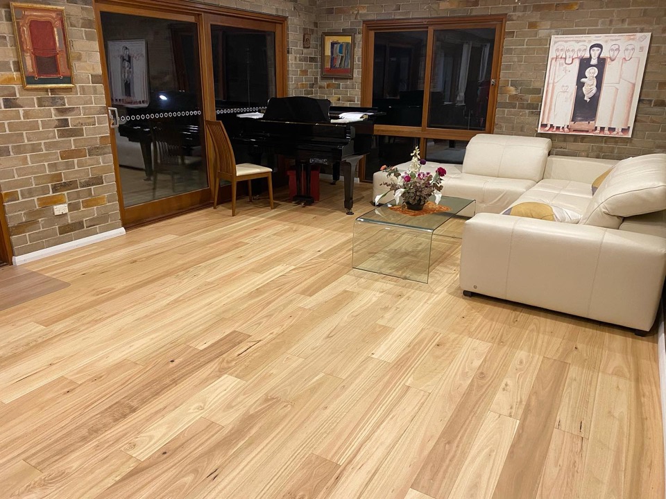 Blackbutt boards beneath the grand piano