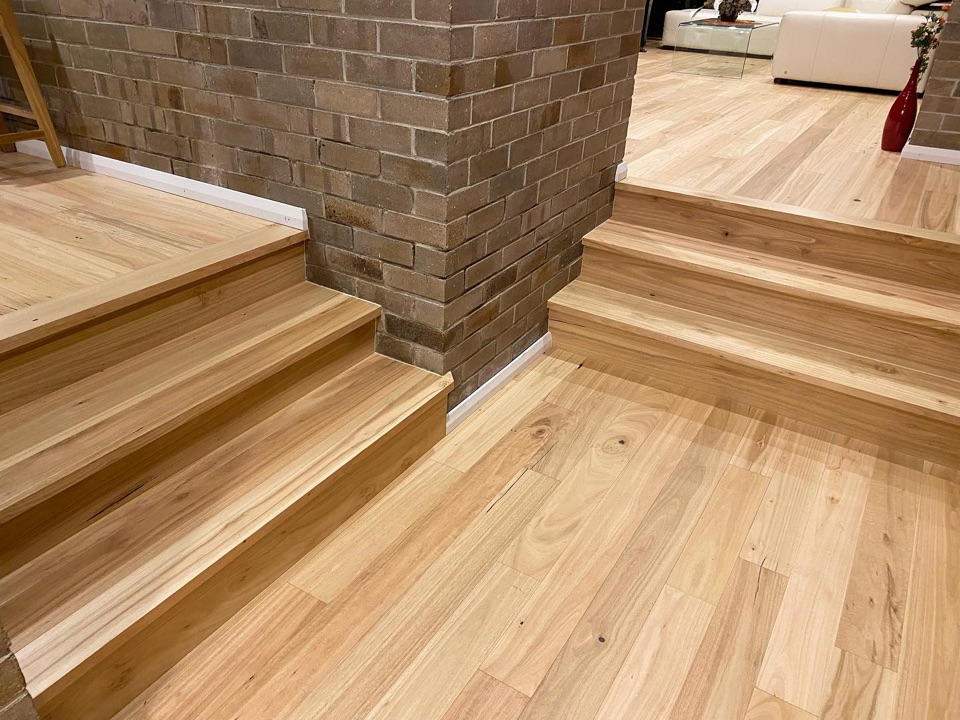 Blackbutt steps wrap around the exposed brick