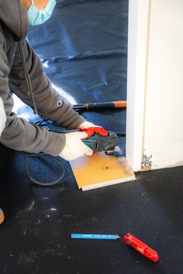 Undercutting the doorway so boards slide under