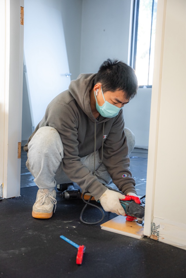 Trimming the door jamb before boards go down