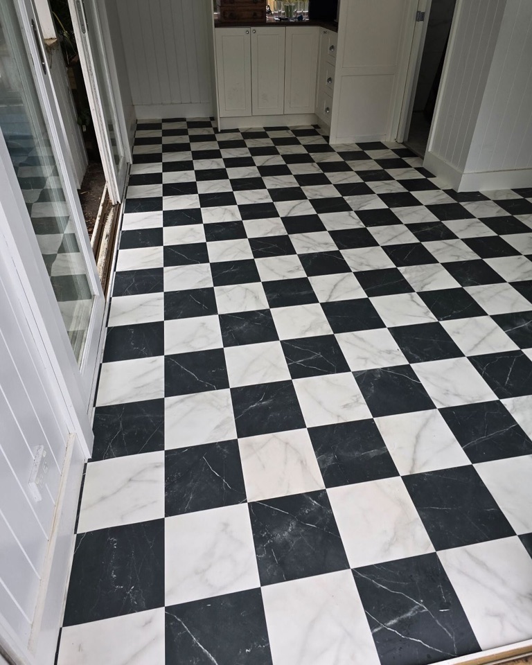 Checkerboard vinyl beside the french doors