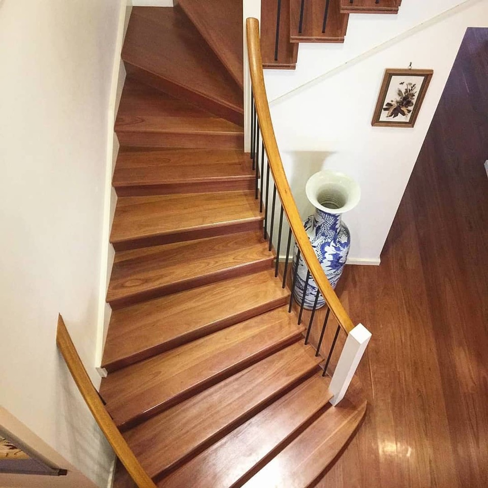 Red ironbark treads winding down the staircase