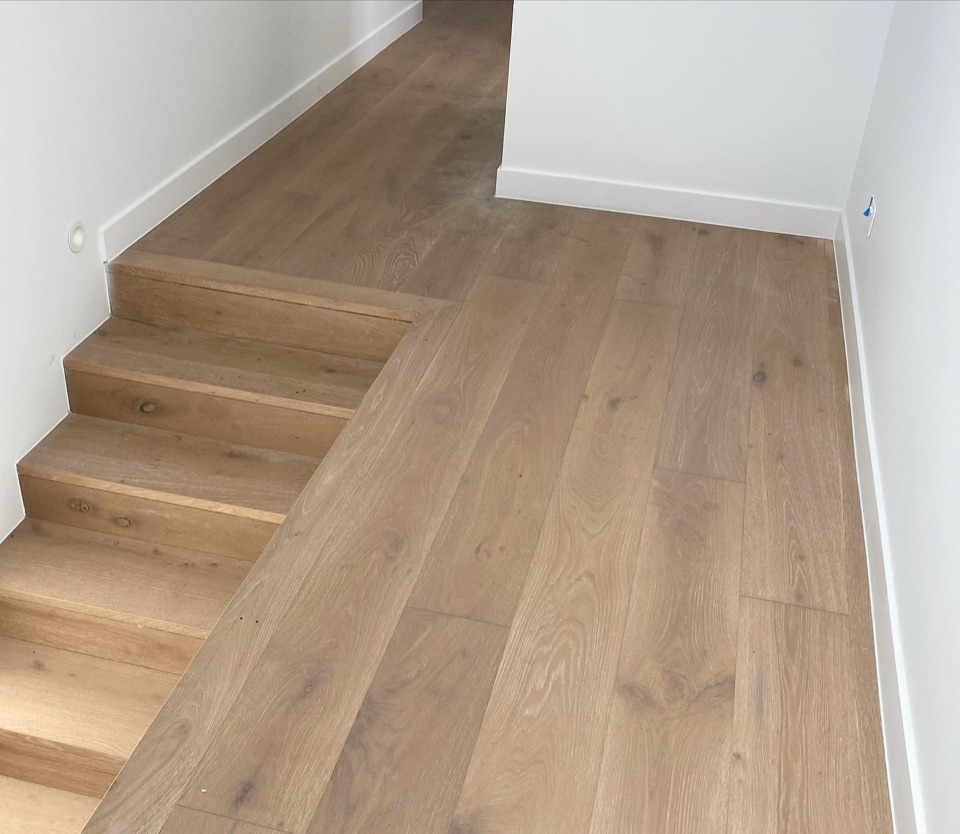 Wide oak boards stepping down the landing