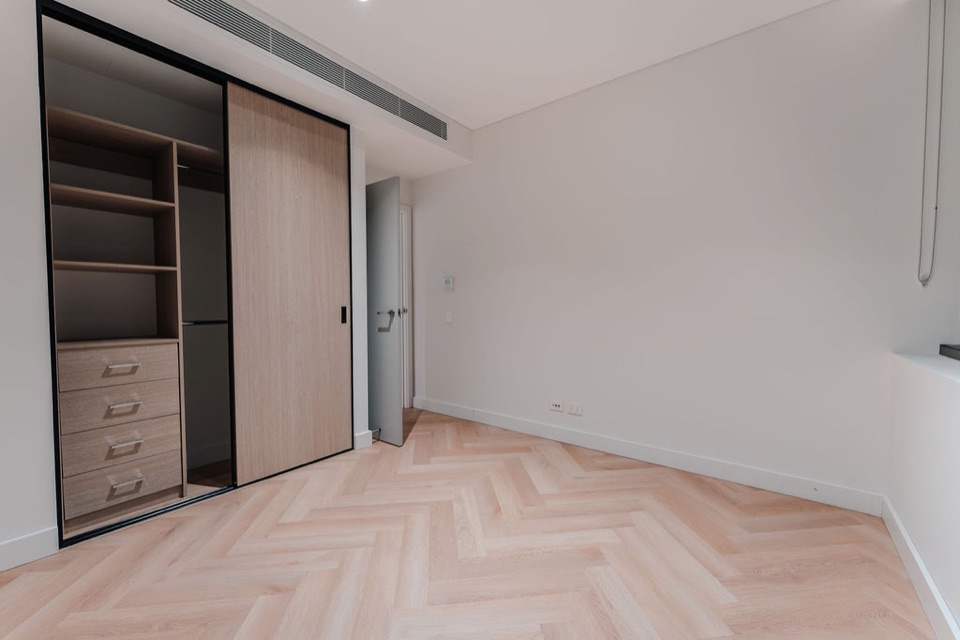 Bloom herringbone laid wall to wall in the bedroom