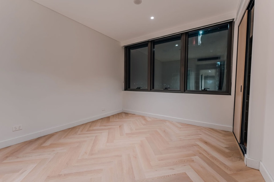 Pale herringbone in the freshly finished bedroom