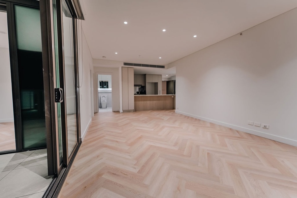 Herringbone runs from the kitchen through the living area