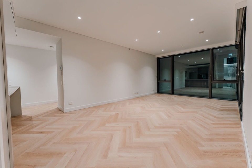 Glass sliders open onto the herringbone living space