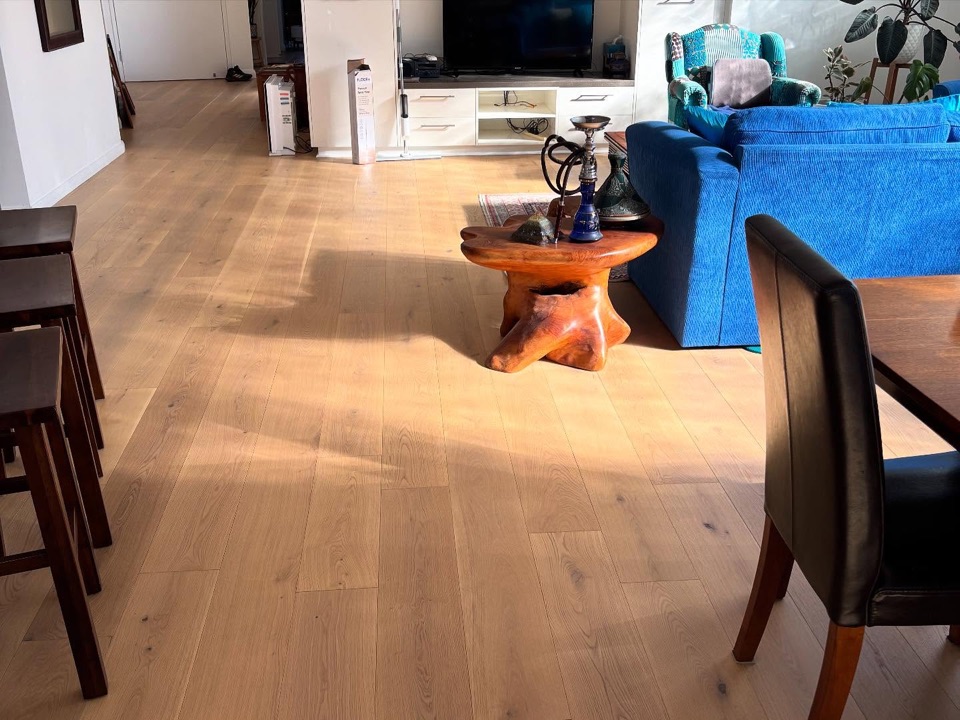 Afternoon sun falls across wide oak boards