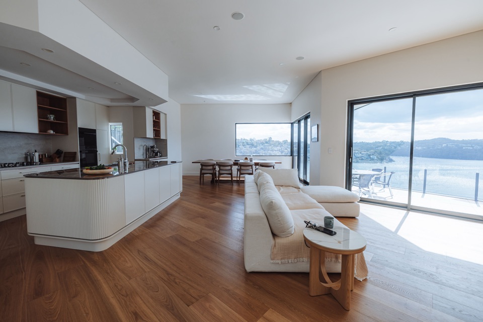 The kitchen island and lounge, with the water beyond