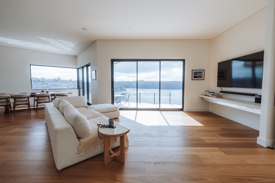 The lounge, facing the TV wall and the harbour