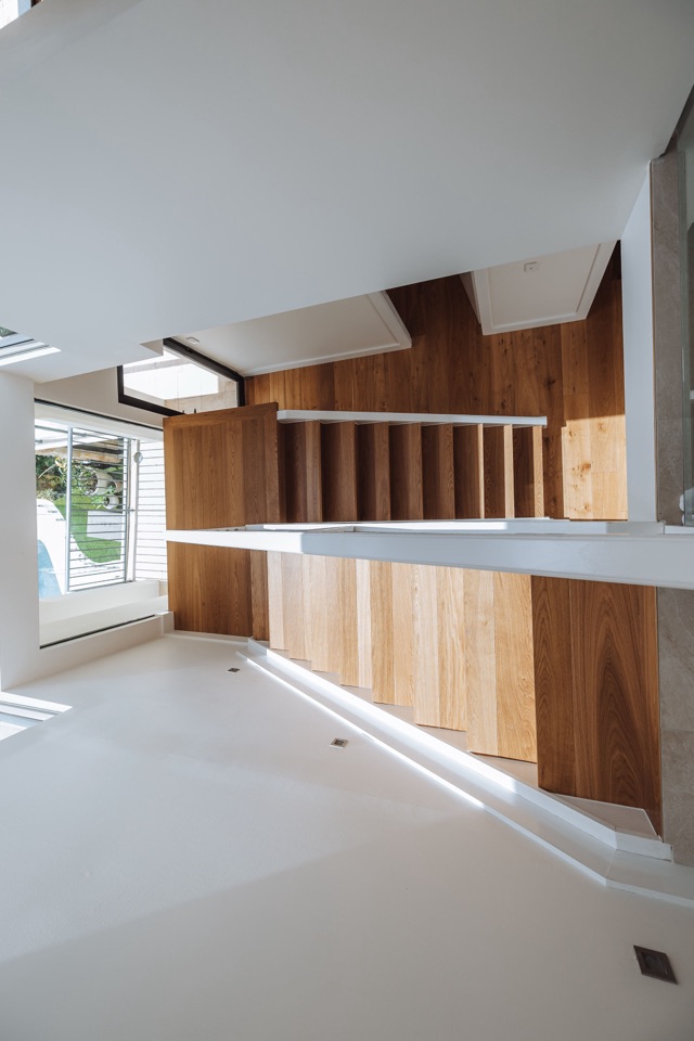Looking down the stairwell to the oak stairs