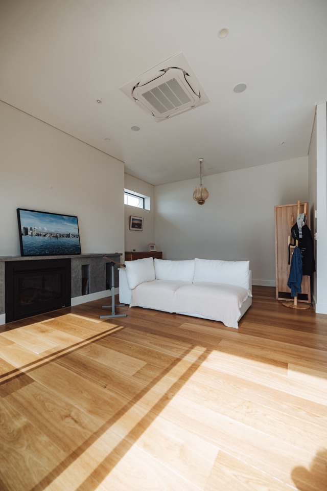 The second living room, sun across the boards