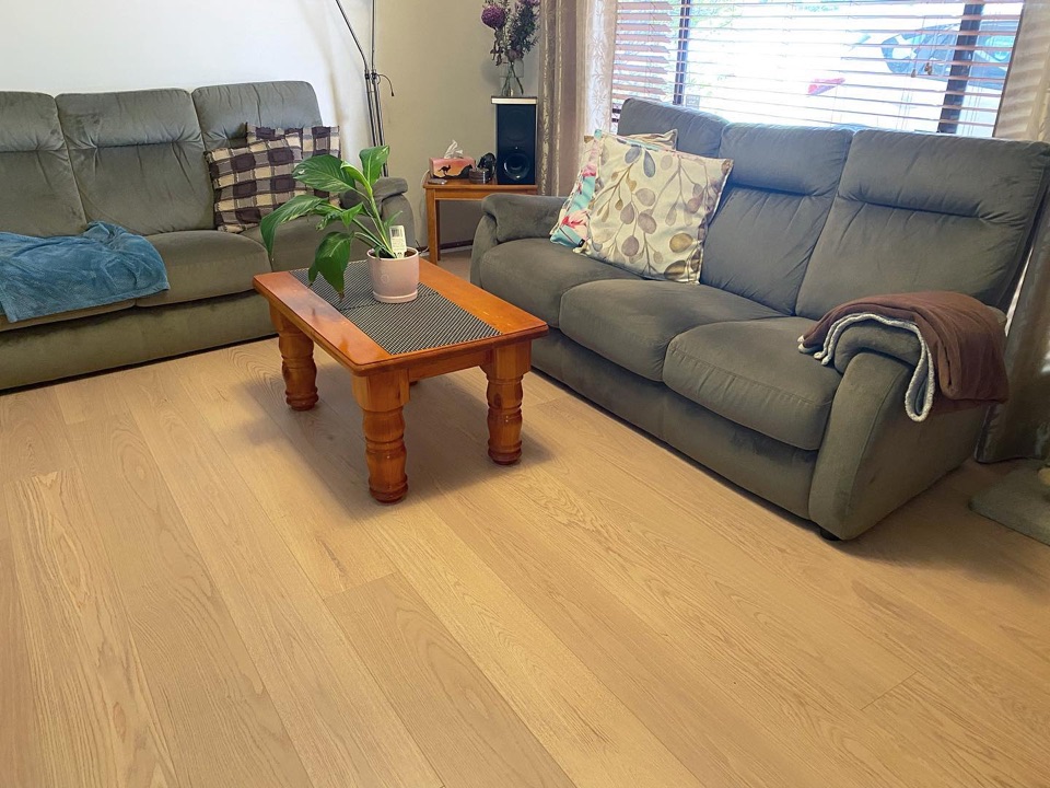 Pale laminate lightens up the cosy lounge room