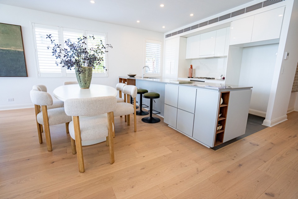 Wide oak boards ground the kitchen and dining