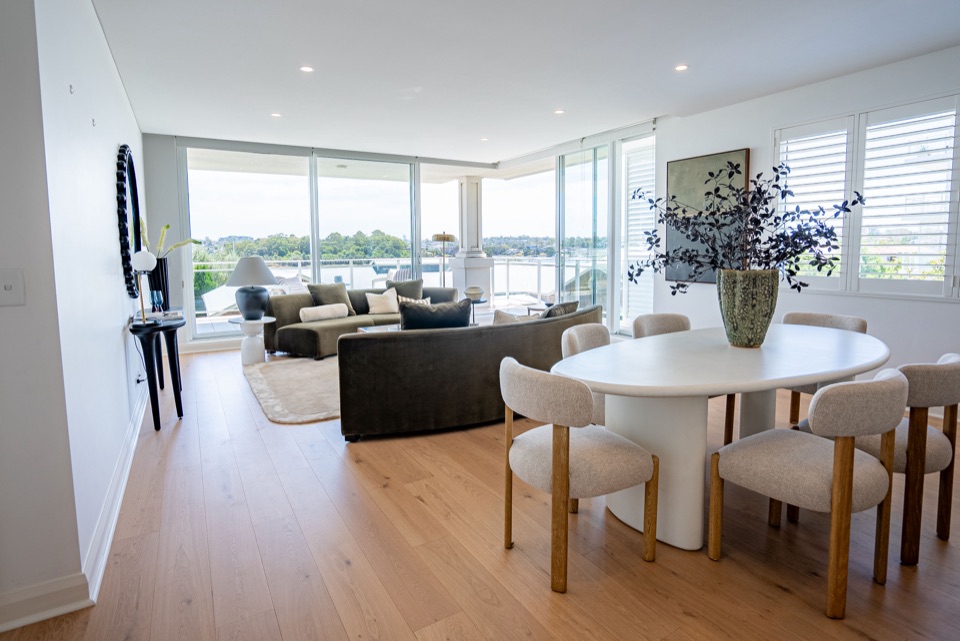 Open plan dining with water views over oak