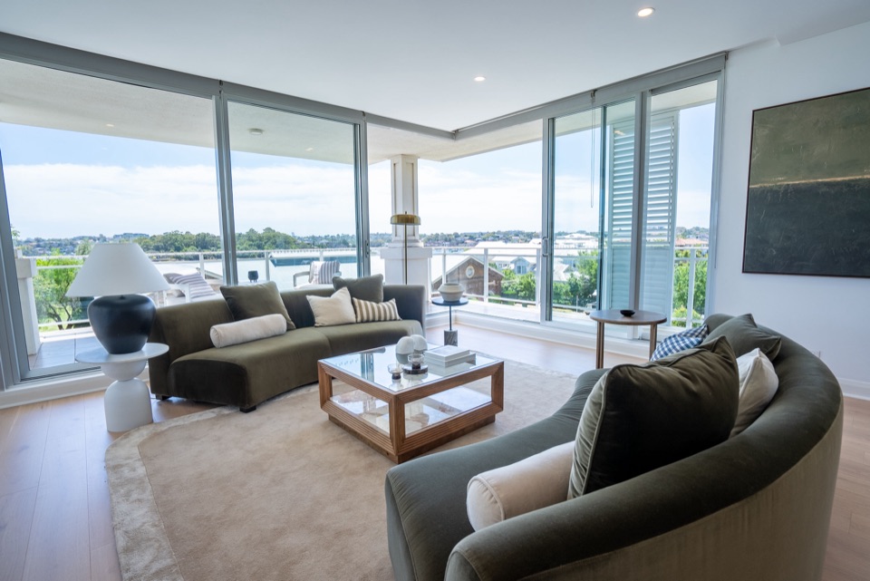 Floor-to-ceiling glass with oak underfoot